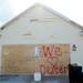 The spray painted message "We love Dexter" covers a boarded up garage door in the Huron Farms subdivision in Dexter on March 19, 2012. Melanie Maxwell I AnnArbor.com